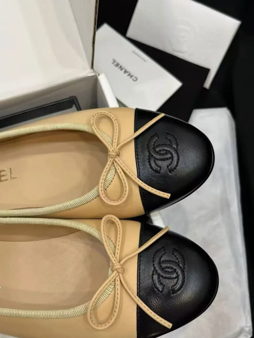 CHANEL Two‑Tone Bow‑Trim Leather Round‑Toe Ballet Flats